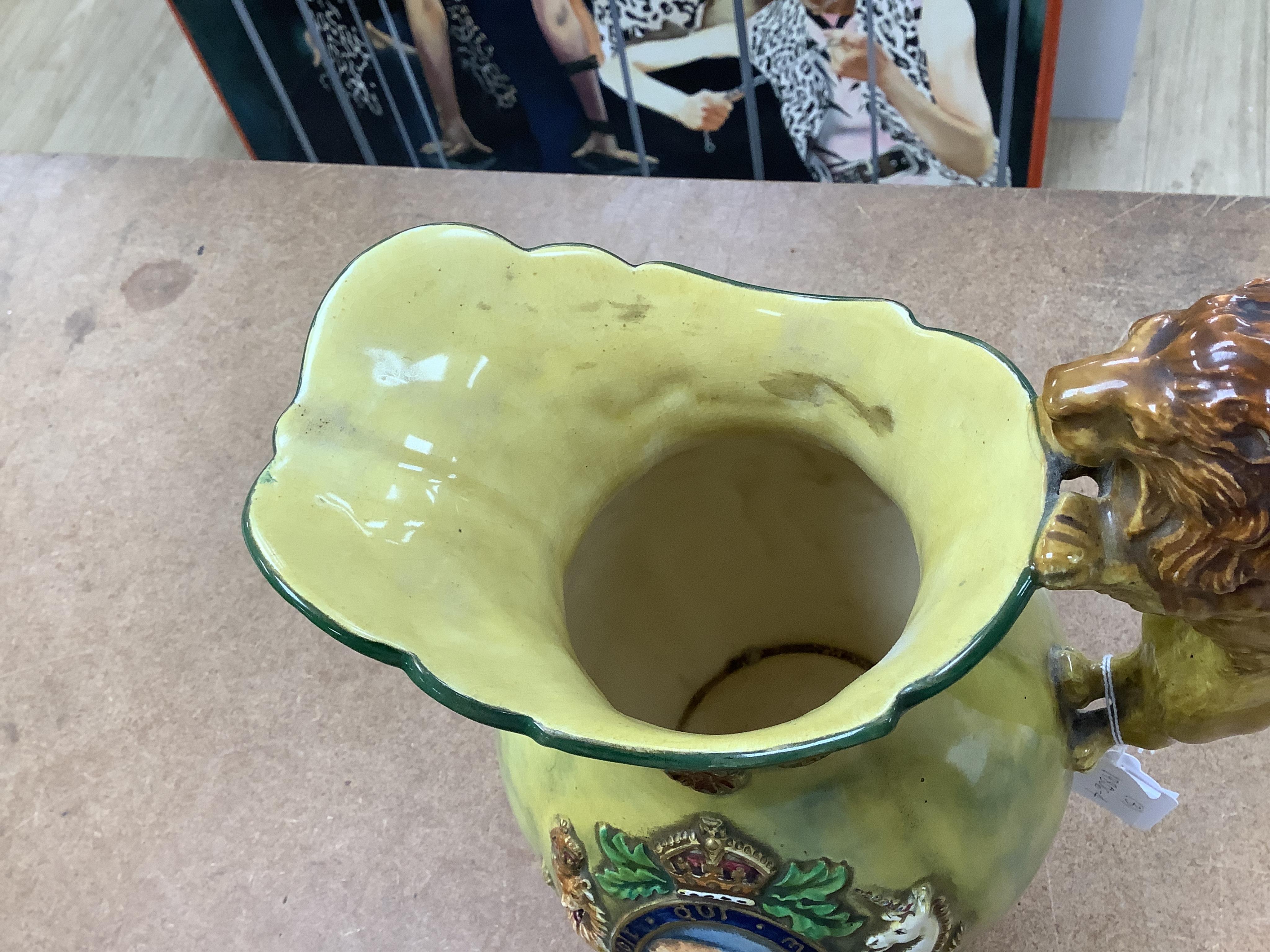 A Crown Devon George VI musical coronation jug, a crown shaped jar with plated cover and a coronation cup, largest 32cm high